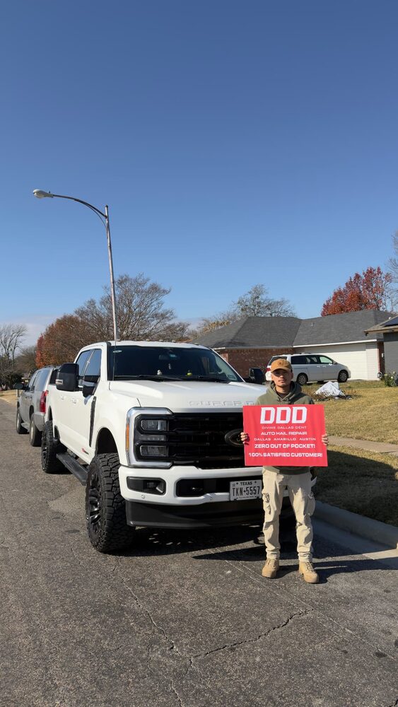 Customer with his repaired white Ford Super Duty truck